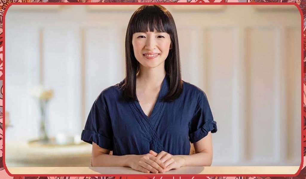 Marie Kondo Japanese woman wearing purple top