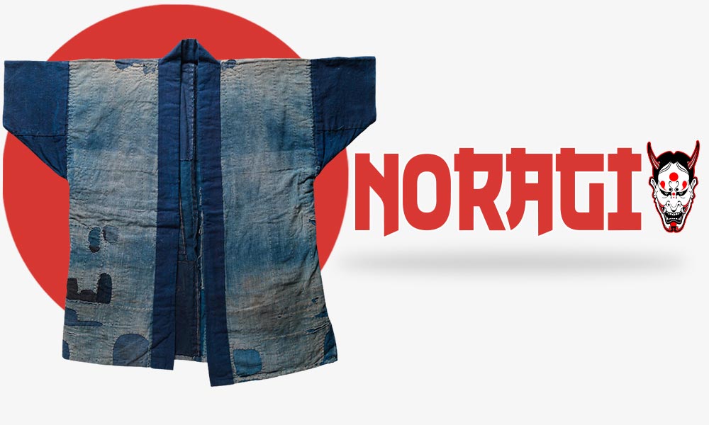 Ce manteau kimono long est un noragi. C'est une veste en forme de T avec des patchworks japonais. C'est l'habit traditionnel japonais de couleur bleu des travailleurs