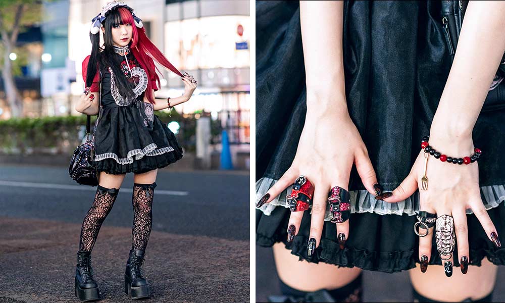 Une fille japoniase est habillée avec une robe gothique Lolita. Elle a des bagues gothiques sur ses doigts