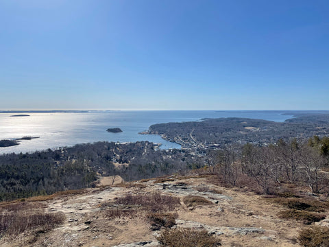 View from Mt. Battie, Camden Harbor and ocean in distance, blue sky