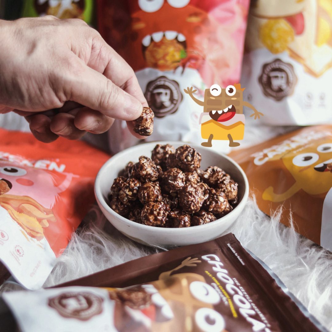 The Kettle Gourmet's chocolate popcorn and surrounding it are our Snack Monsters