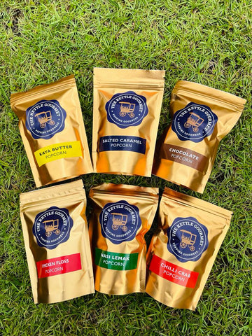 The Kettle Gourmet's mini golden popcorn packaging featuring 6 flavours  - chocolate, chilli crab, salted caramel, chicken floss, kaya butter toast, and nasi lemak.