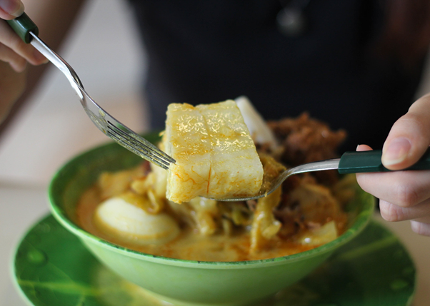 Queenstown Lontong's Lontong, or rice cakes, nestled in a broth with coconut milk