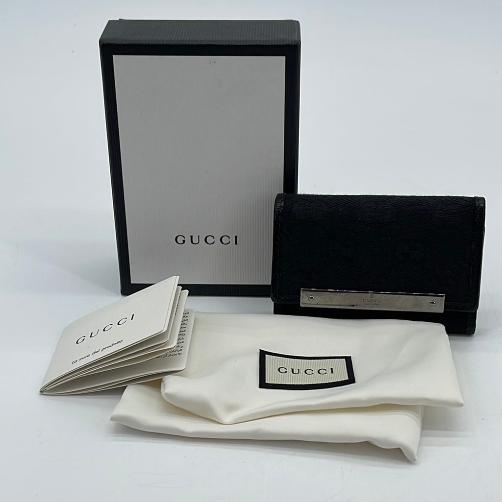 Shop the Gucci Signature key case by Gucci. A key case made in heat  debossed Gucci Signature leather with a defined prin…