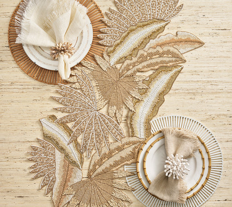 Kim Seybert Java Runner in Natural, Gold & Silver paired with Spoke Placemats and Reed and Shell Fringe Napkin Rings