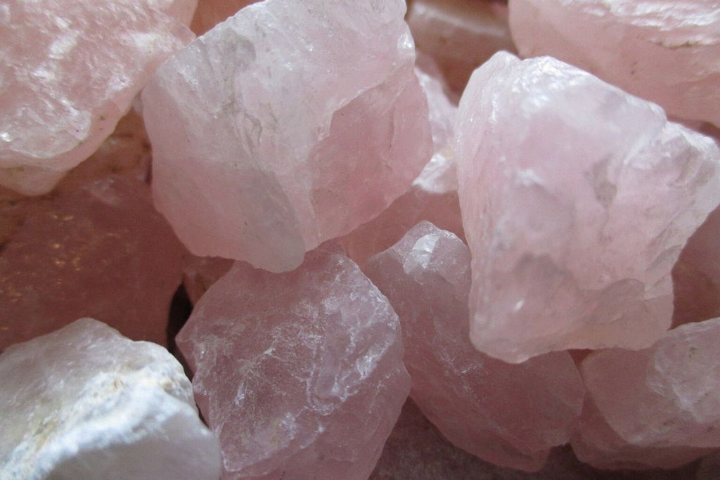 collection of raw rose quartz crystals
