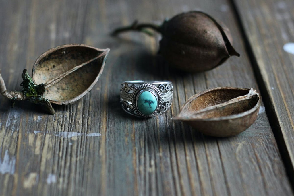 Turquoise ring on table