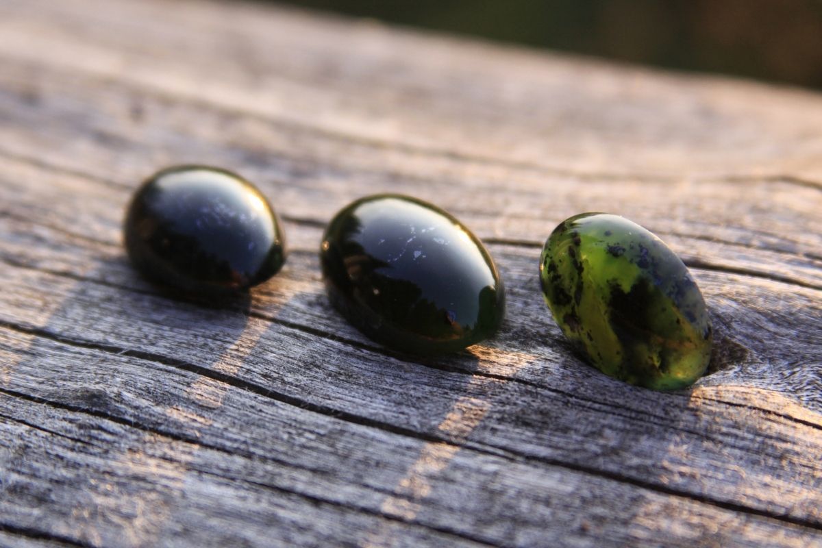 Jade and other stones on wood in the sun