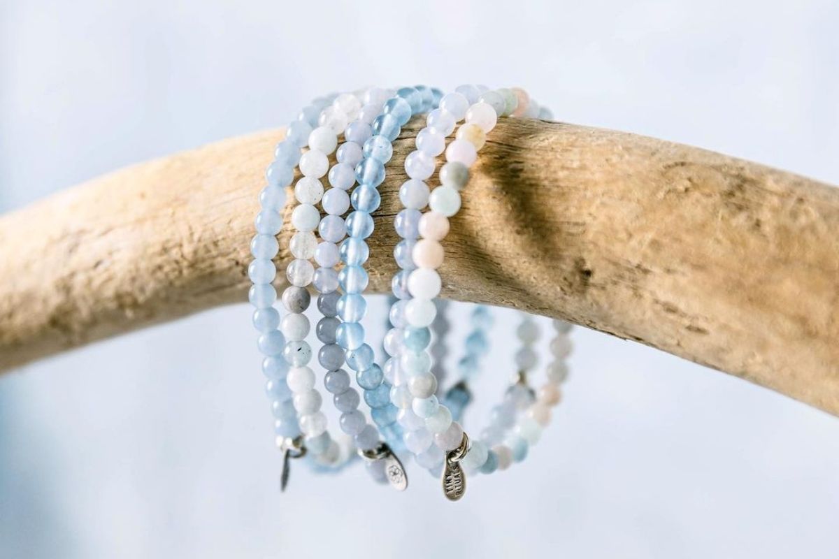 blue crystal bracelets for throat chakra hanging on branch