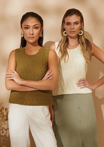 One medium skinned model with dark hair wearing gold colored tank top in Rowan Cotton Glace and one light skinned model with dark blond hair wearing the same tank in white