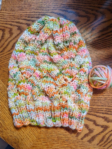 lacey hat in pink and salmon and green tones