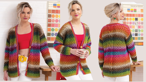 blond model wearing Cardigan knit in Noro Haruito.  Cardigan features eyelet stitch, and stripes of green pink, green, orange, and magentaan with long sleeves.