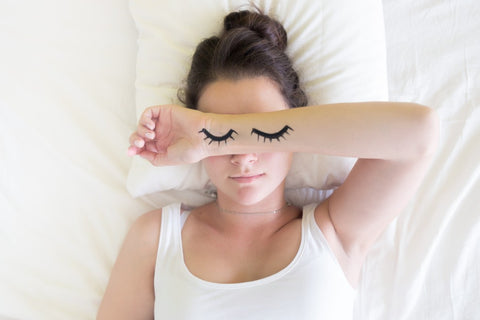 young woman laying in bed