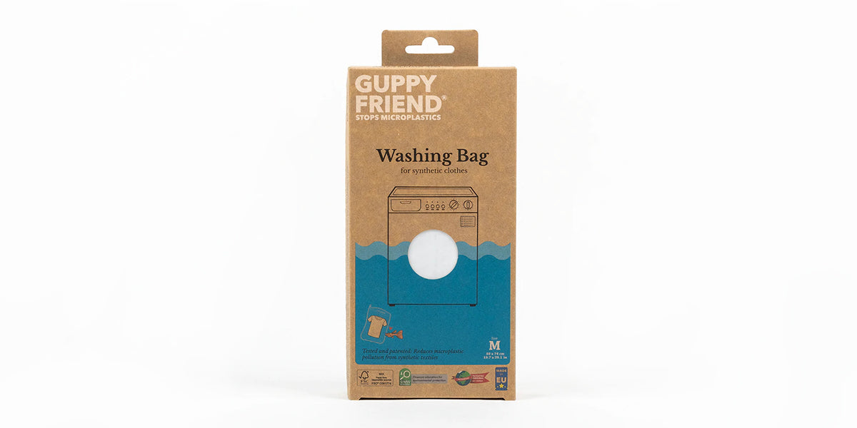 Guppyfriend product packaging - brown box with white and blue writing. 