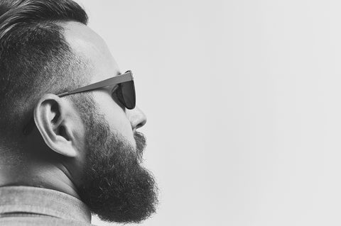 man with beard and sunglasses looking to the right