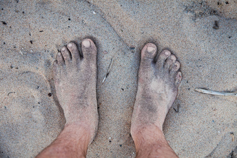 men's feet sandy and dirty