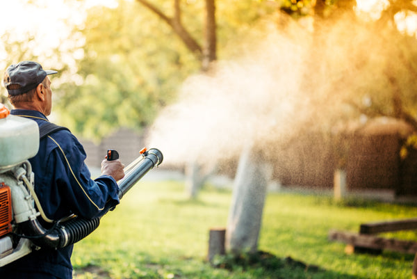 Man with backpack mosquito fogger spraying solution. Invatech Italia