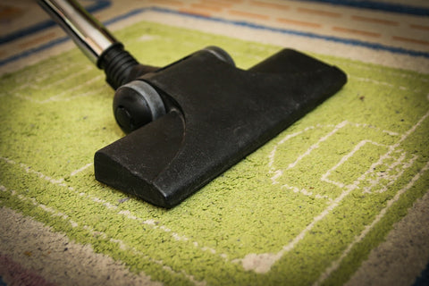 A picture of a vacuum on a rug