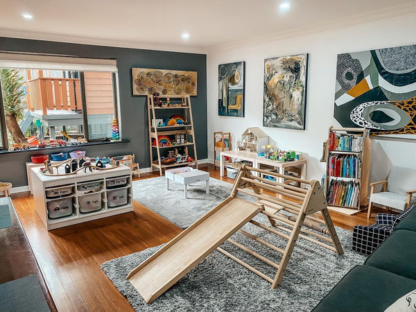 Playroom in living room with storage shelves