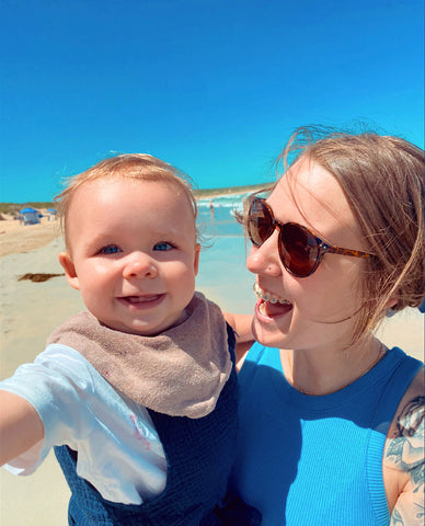 mother and baby happy at beach