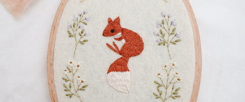 close up of an embroidered red fox by Claire Orth