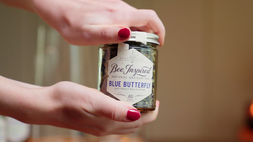 hands holding a jar of tea