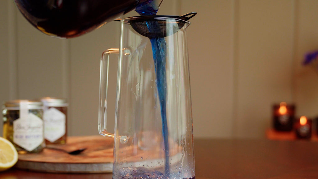 strain tea by pouring into a strainer