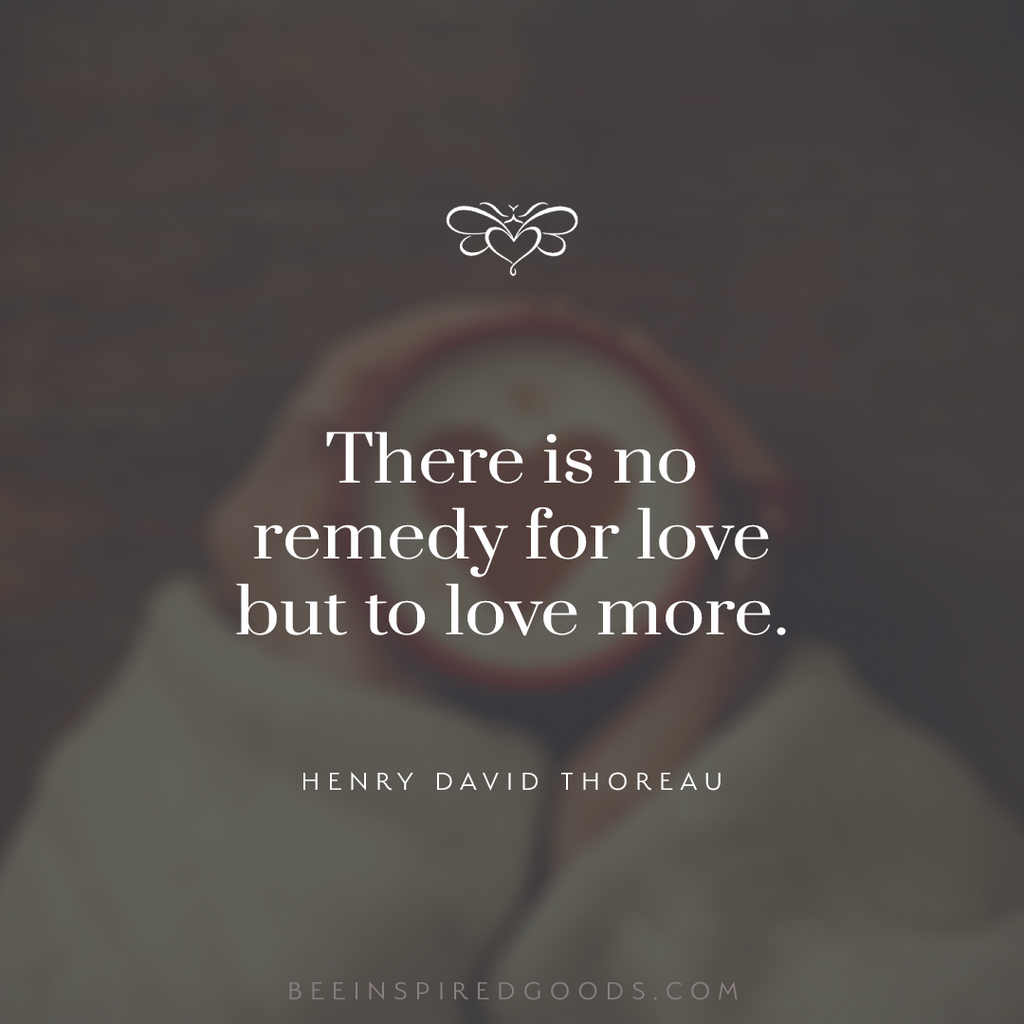 Henry David Thoreau quote in front of a woman holding a cup of coffee with a foam heart