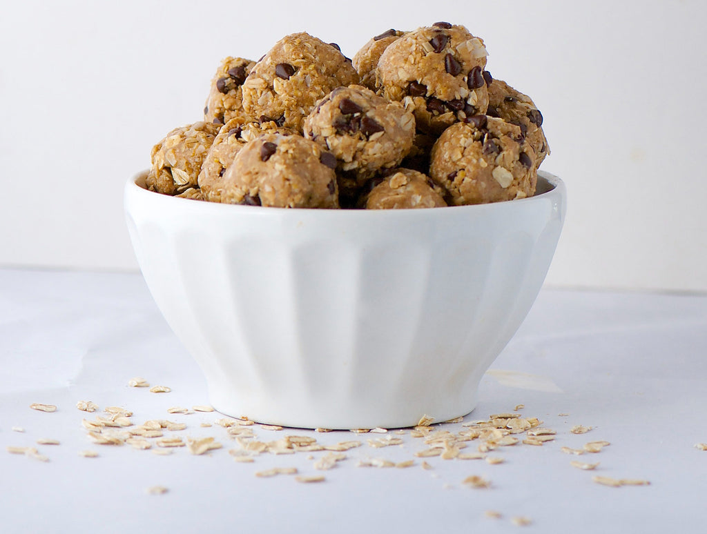 Honey nut balls in a white bowl by Bee Inspired