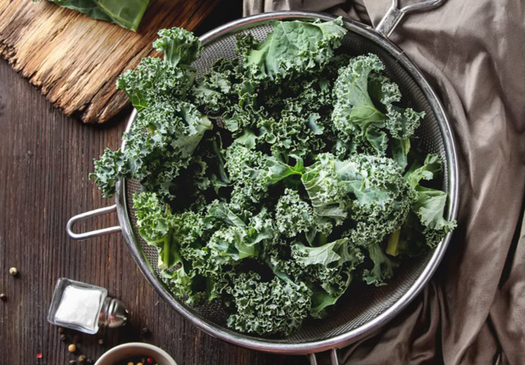 Fresh kale in a metal strainer