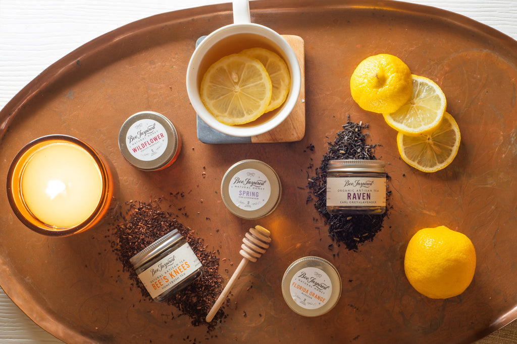 Contents of Bee Inspired's Tea for Two Tower on a copper tray with raw ingredients