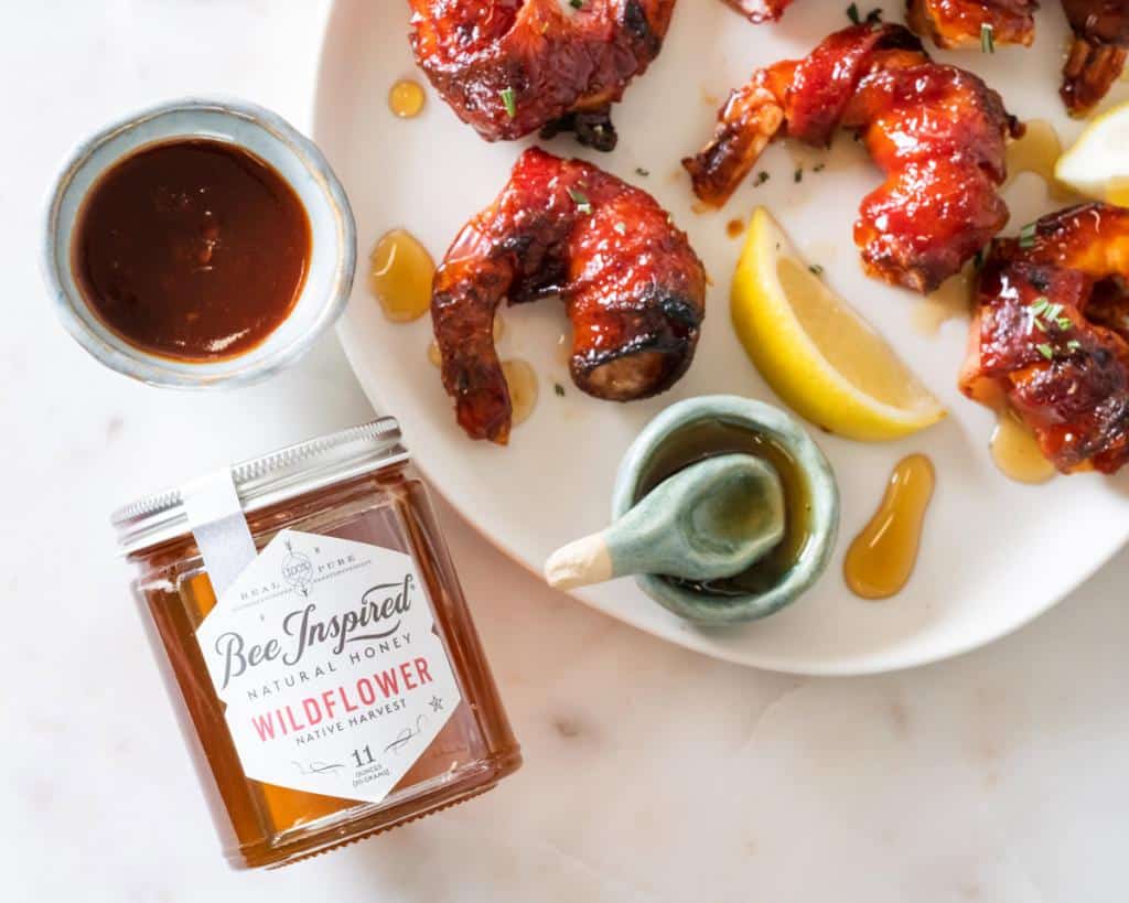 Bacon wrapped shrimp with honey glaze with Bee Inspired wildflower honey