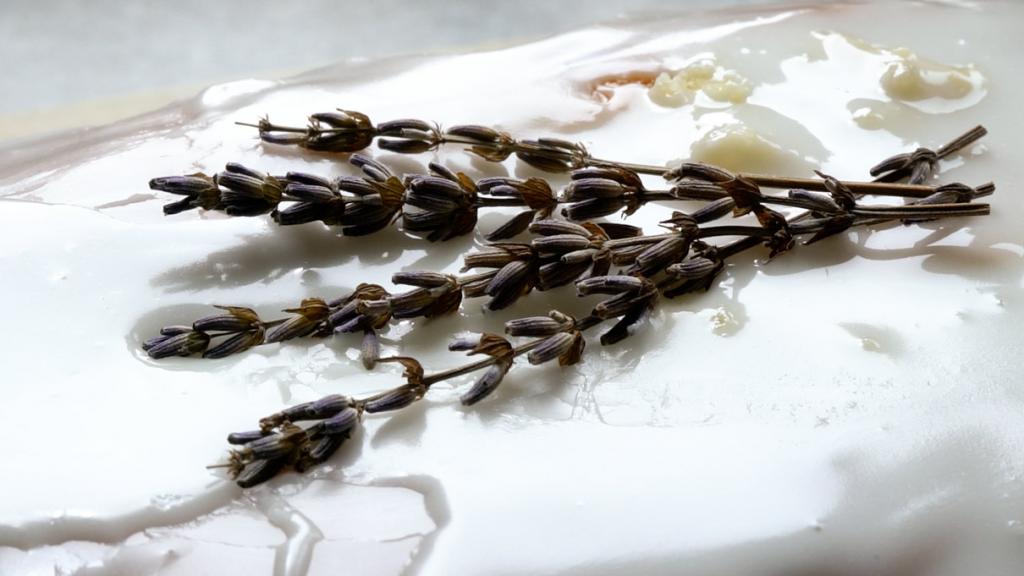 Lavender Honey Lemon Cake icing with lavender garnish