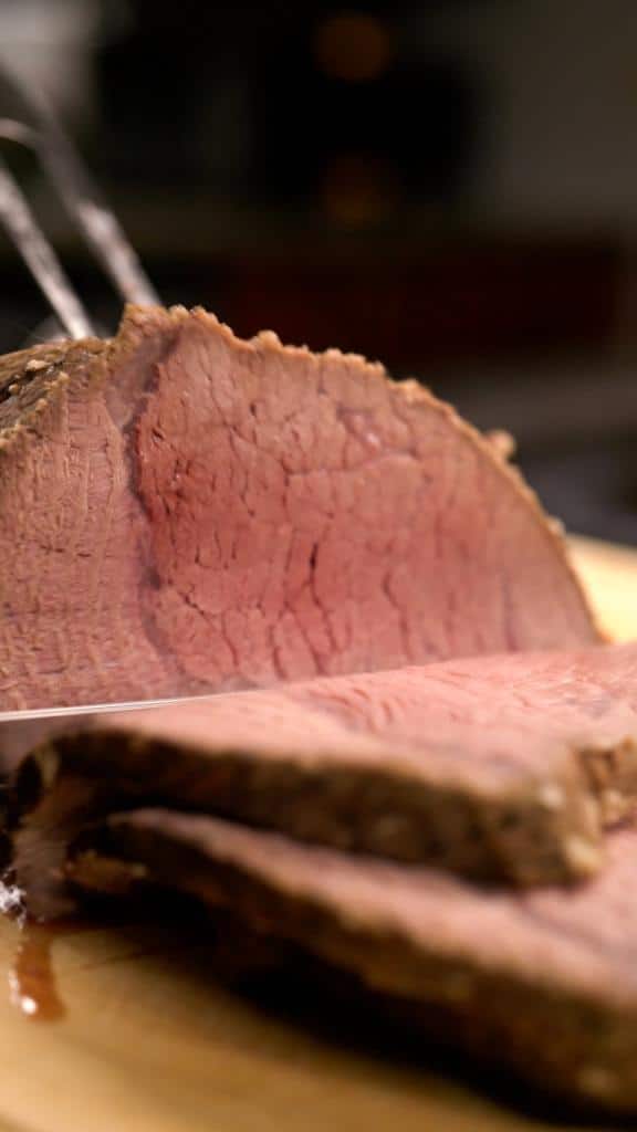 slicing pot roast on platter