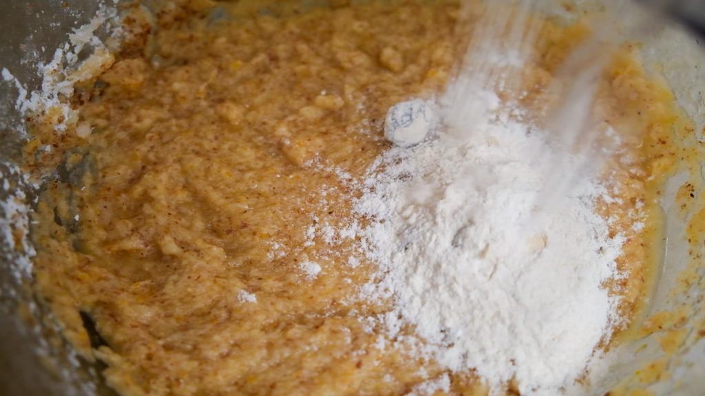 adding flour to Cranberry-Orange Biscotti dough in the making
