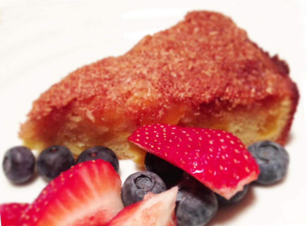 Paleo Crumb Cake with fresh cut strawberries and blueberries