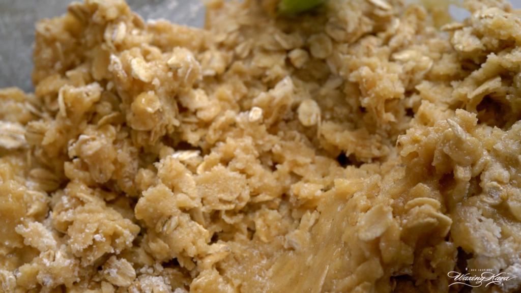 combining oatmeal and cookie dough