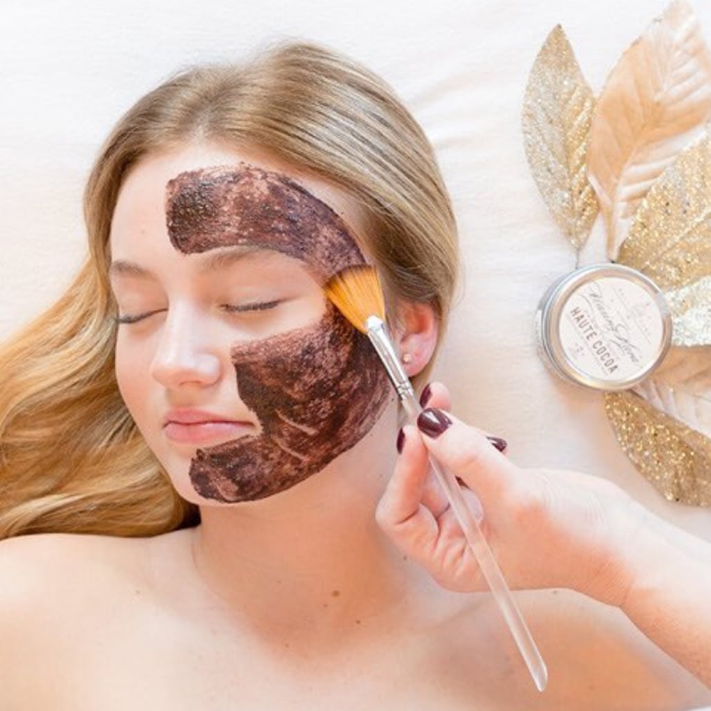 Haute Cocoa Mask being applied with a makeup brush