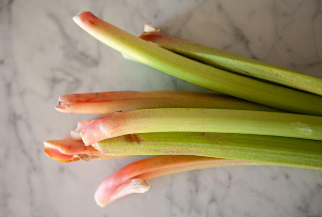 Rhubarb laying on marble surface