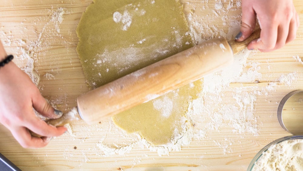 Rolling out sugar cookies for national sugar cookie day