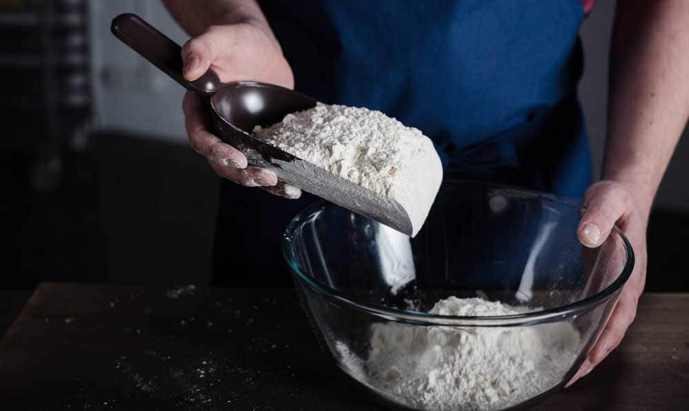 sifting dry ingredients together for beer bread