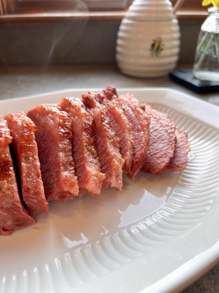 a slice of corned beef on a plate