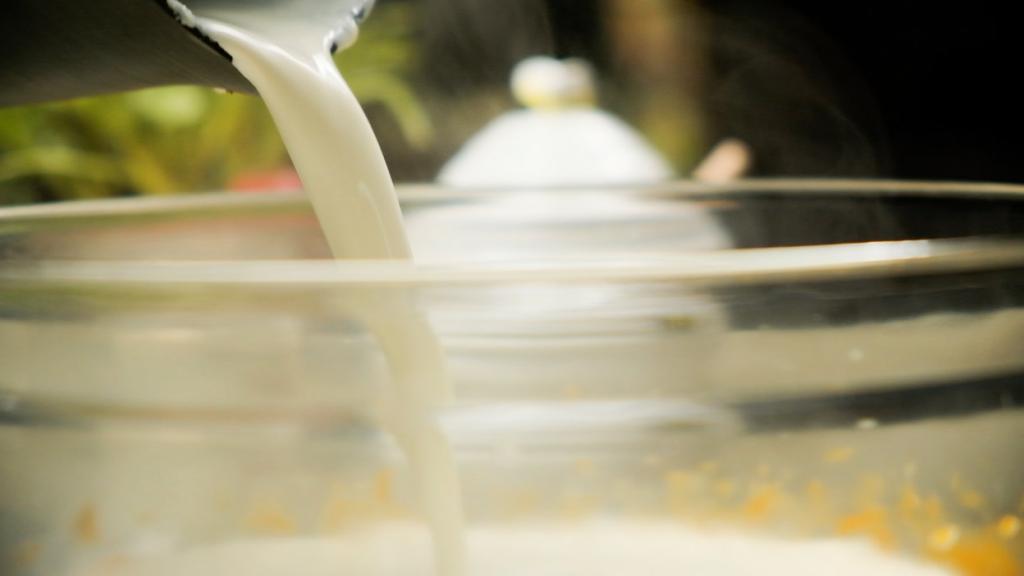 Adding warm cream to pumpkin pie batter