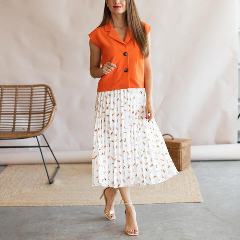 White pleated skirt with orange vest