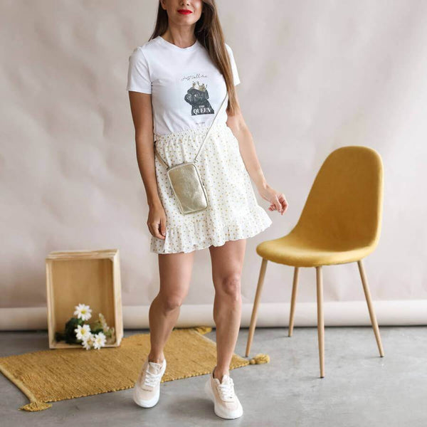 White skirt look with sneakers