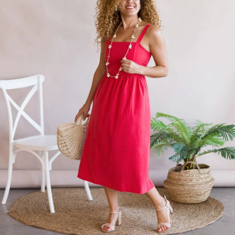 Red dress with raffia bag