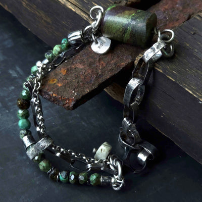 rustic looking silver handmade bracelet with turqoise beads, amber beads, oxidised silver chain