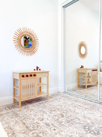 Boho Round Wall Mirror next to Tumble Rug