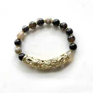 Scratch bracelet. Agate bracelet. Golden focal point and natural gray and black agates one of a kind.
