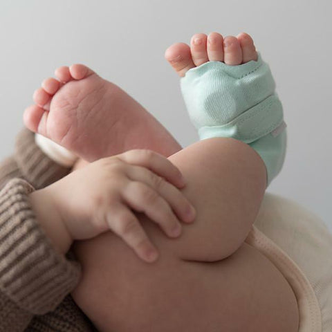 Owlet Baby Monitor Sock in Mint Green on Baby's Foot